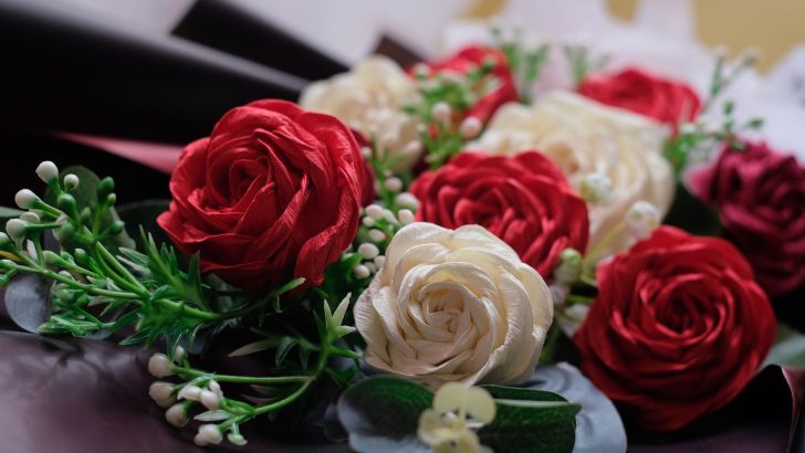 Beautiful close-up of a red and white artificial rose bouquet showcasing floral arrangement.