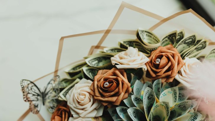 Unique bouquet of dollar bills and paper roses with a butterfly accent.